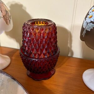 Vintage Ruby Red Indiana Glass Diamond point Fairy Lamp with a gold tint.
